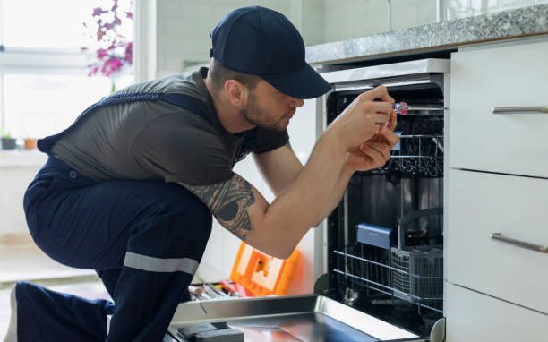Dishwasher being installed under a worktop