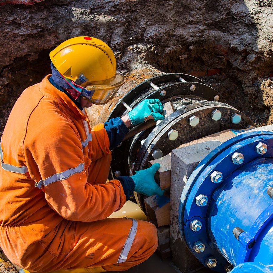 Engineer working on a large underground water main