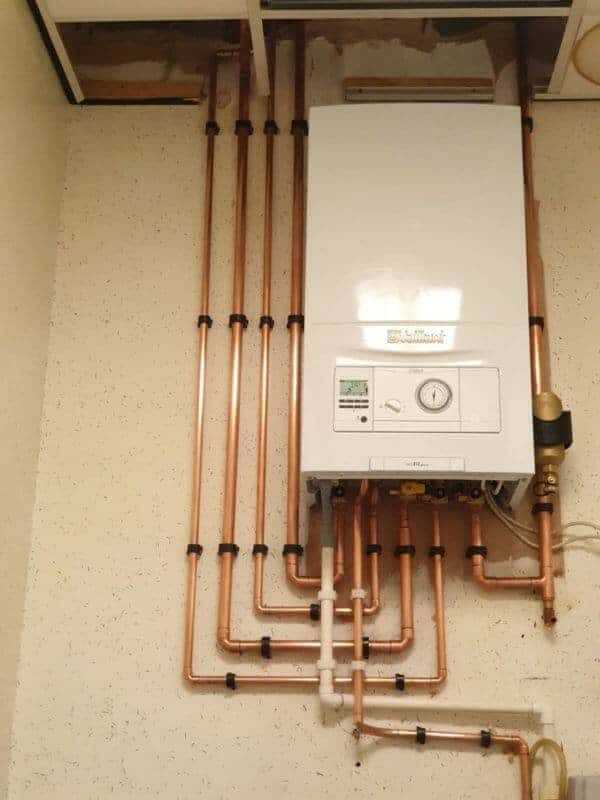Vaillant boiler with a filter and neatly clipped copper runs
