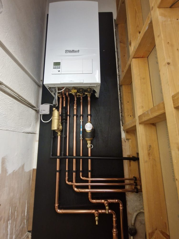 Vaillant ecoFIT pure on a black backboard with a Vaillant filter