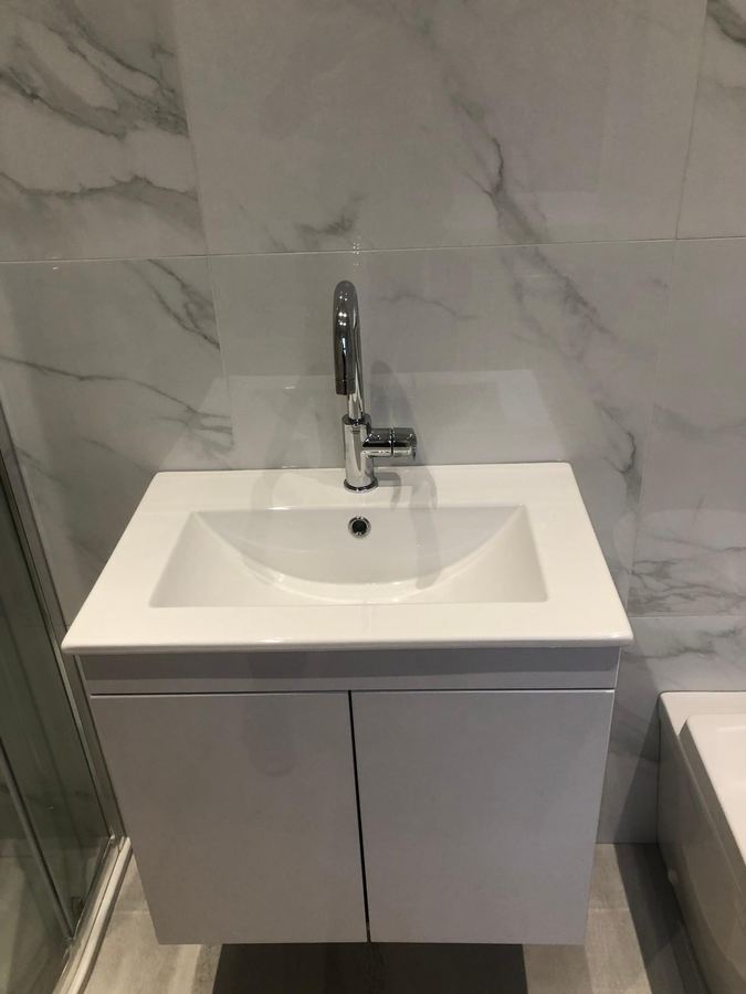 Vanity basin on marble tiles