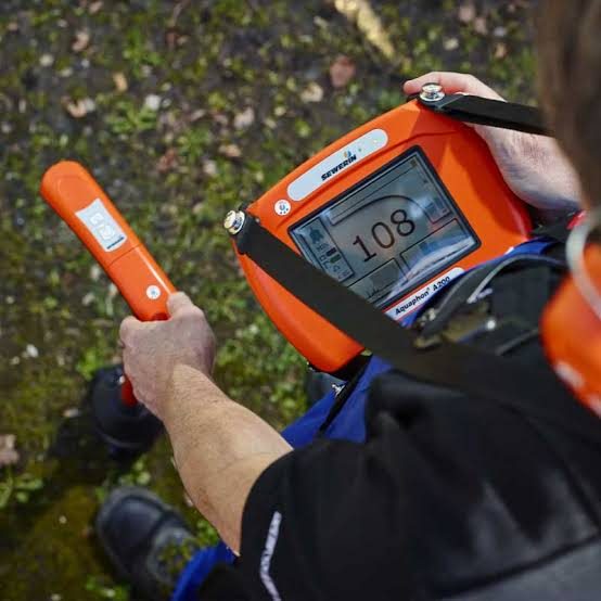 Acoustic leak detector being used over the ground outside
