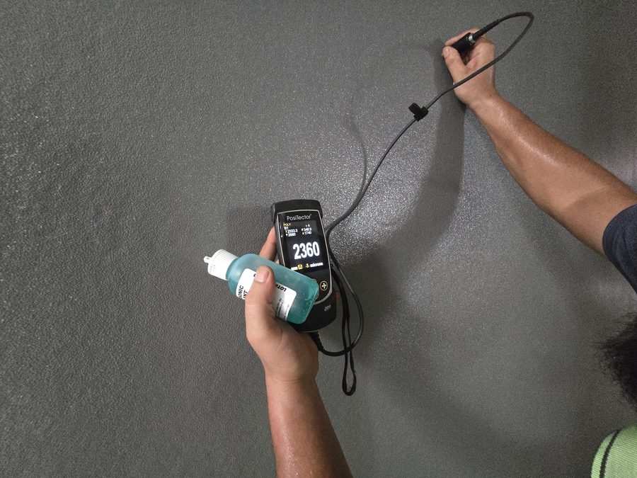 Engineer taking readings with a handheld gauge