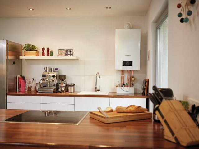 Wall-mounted boiler fitted in a modern kitchen above the worktop