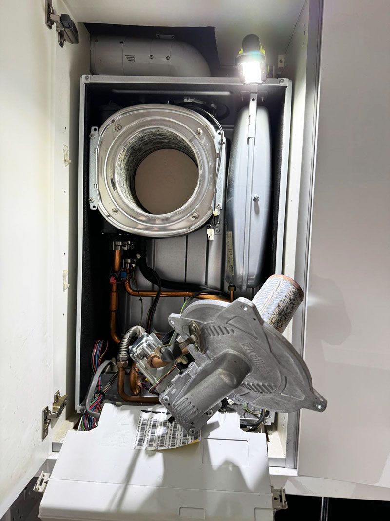 Vaillant burner and fan assembly lifted out during a service