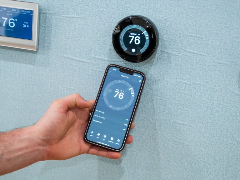 The Nest app controlling the thermostat from a phone