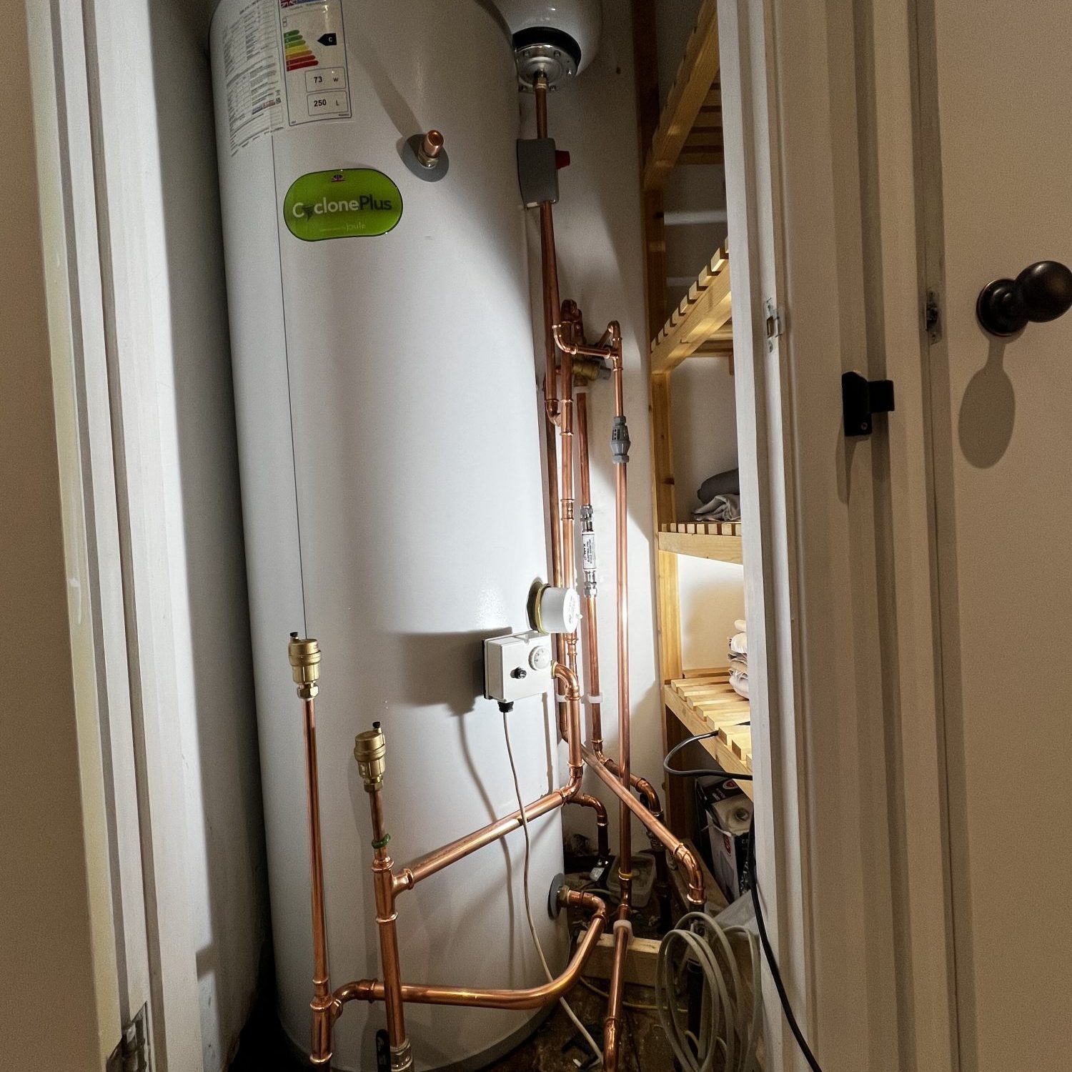Joule Cyclone Plus 250 litre unvented cylinder in an airing cupboard