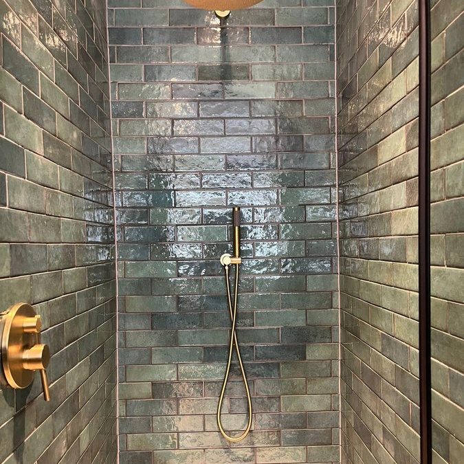 Brass shower on metro tiles